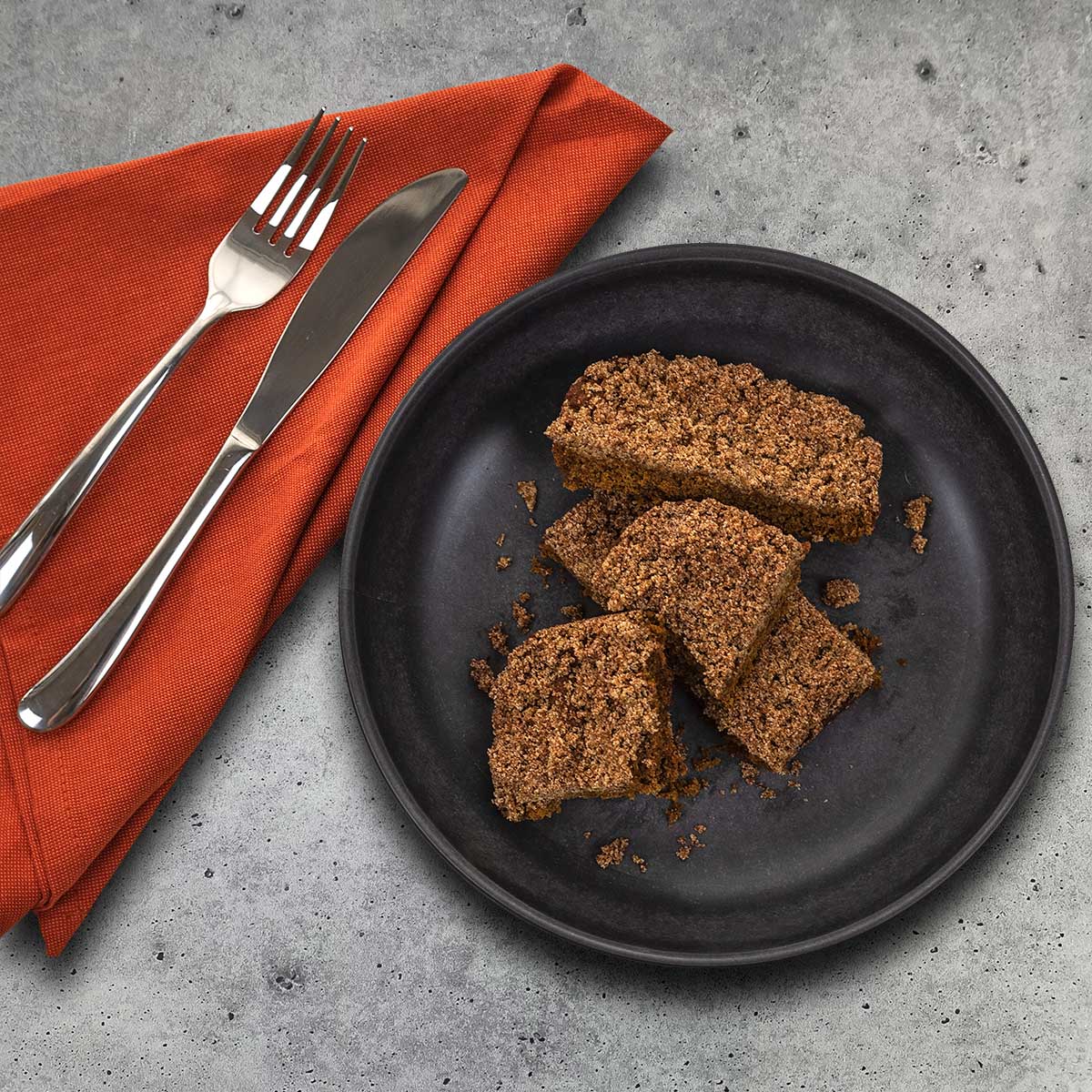 Overhead of Pumpkin Spice Crumb Cake slices with napkin aip