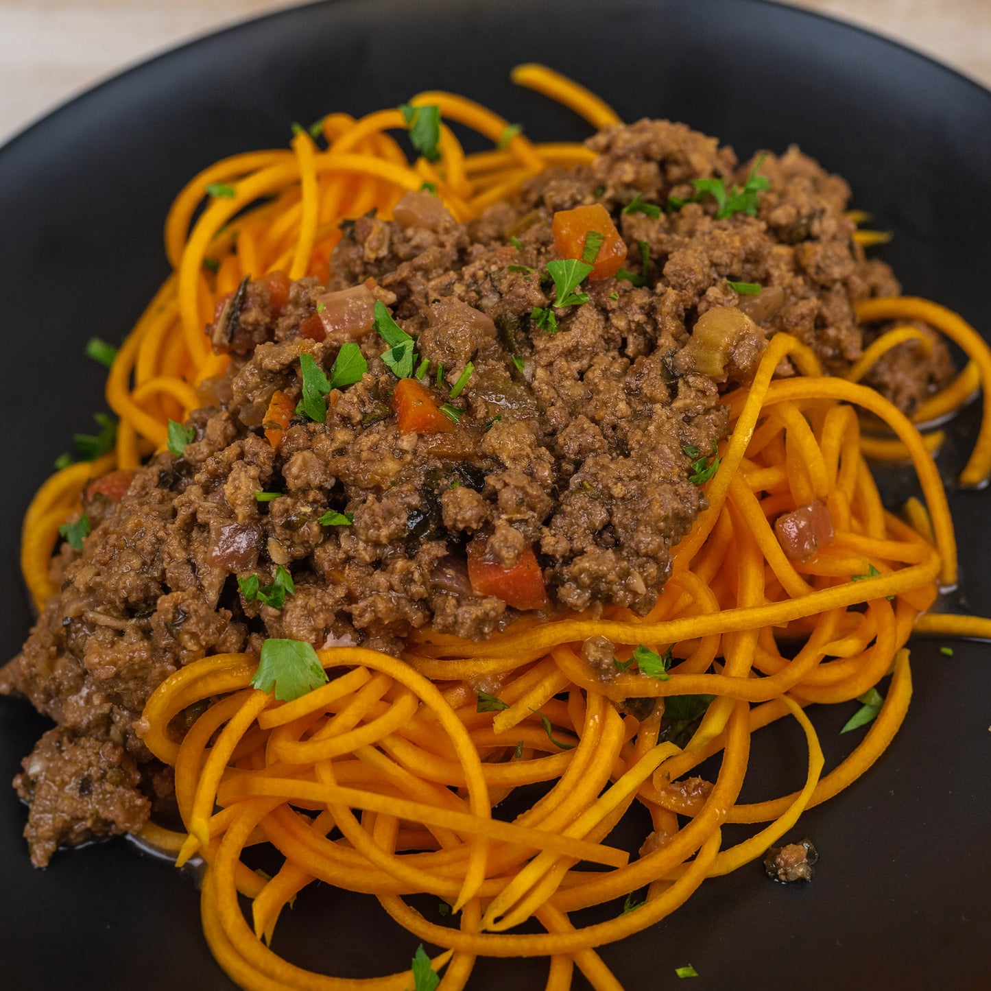 paleo orange squash noodles and beef bolognese